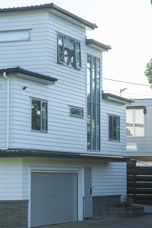 New Wave Construction Renovation three story house re-cladding