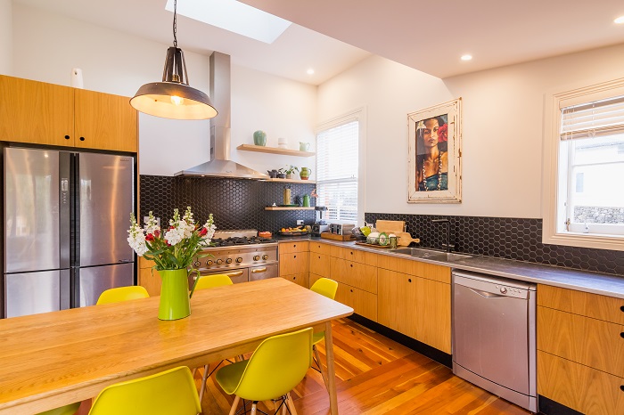 New Wave Construction Villa Renovation Kitchen with plywood custom and Large Skylight