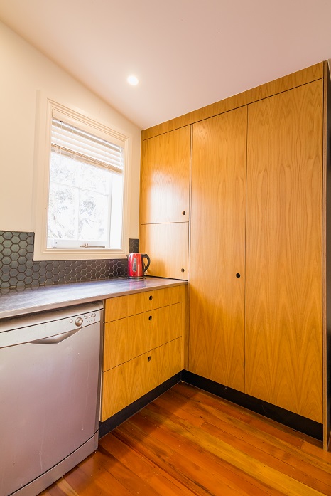 New Wave Construction Villa Renovation Kitchen with plywood custom and Large Skylight