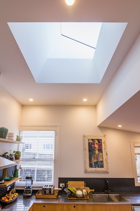 New Wave Construction Villa Renovation Kitchen with plywood custom and Large Skylight